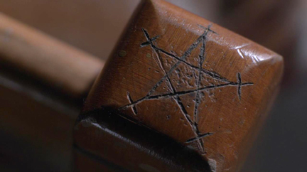 Protective symbol carved into Dean's old bed post.